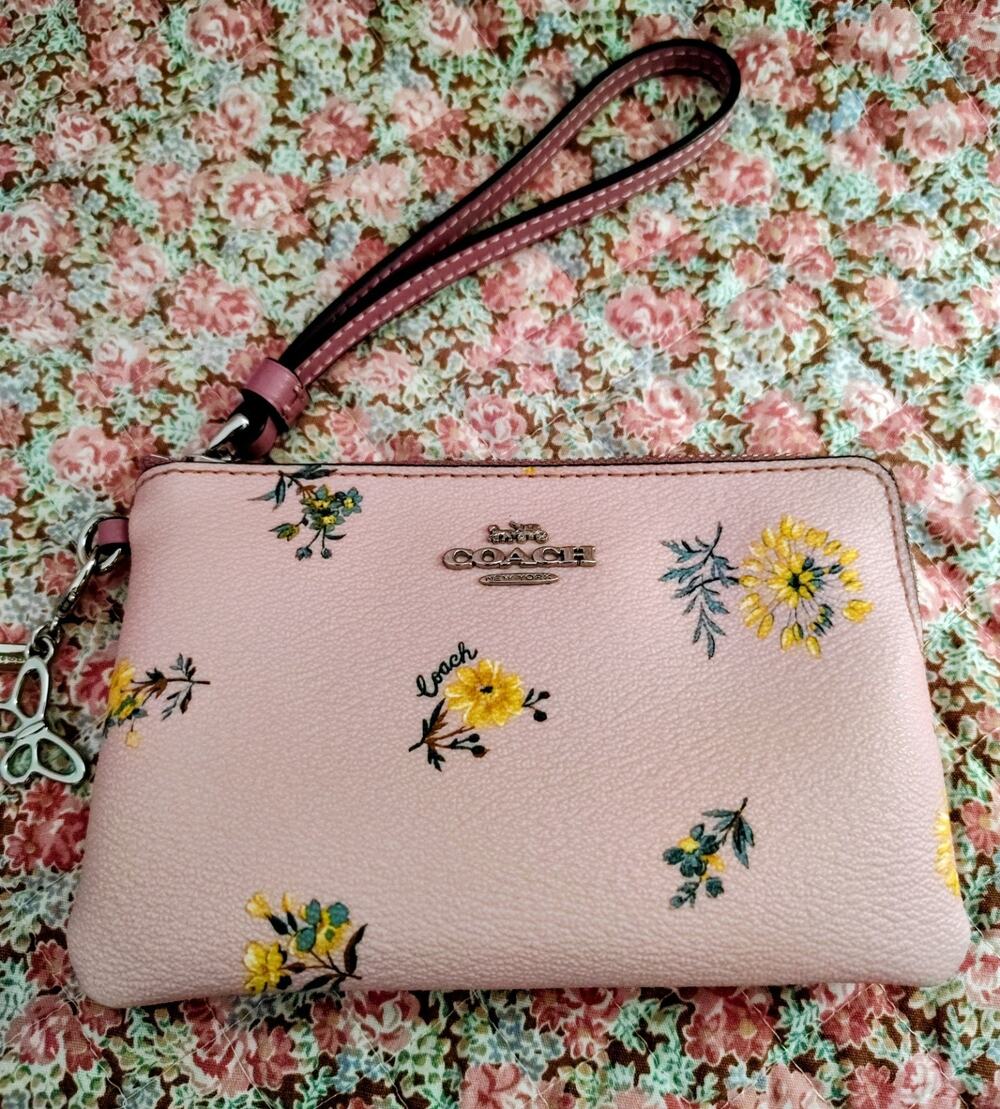 Coach Pink Floral Zip Wristlet With Butterfly and Coach C Bag Charms